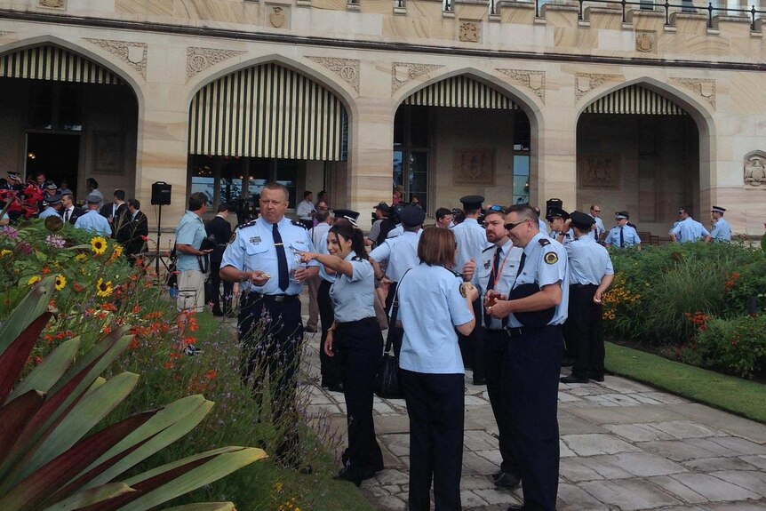 Police in the NSW Government House garden for the Premier's morning tea for siege workers