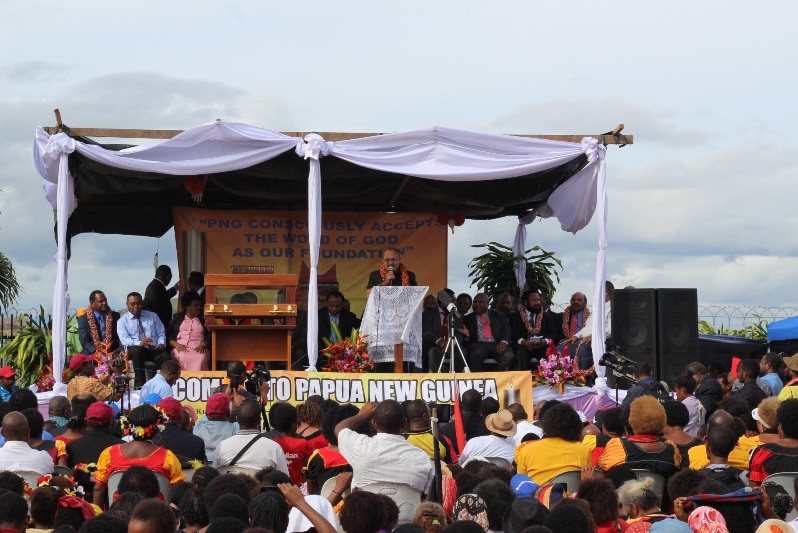 Papua New Guinea's prime minister Peter O'Neill receives a 400-year-old bible