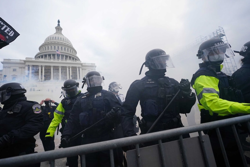 Police stand guard against Trump supporters at the US Capitol