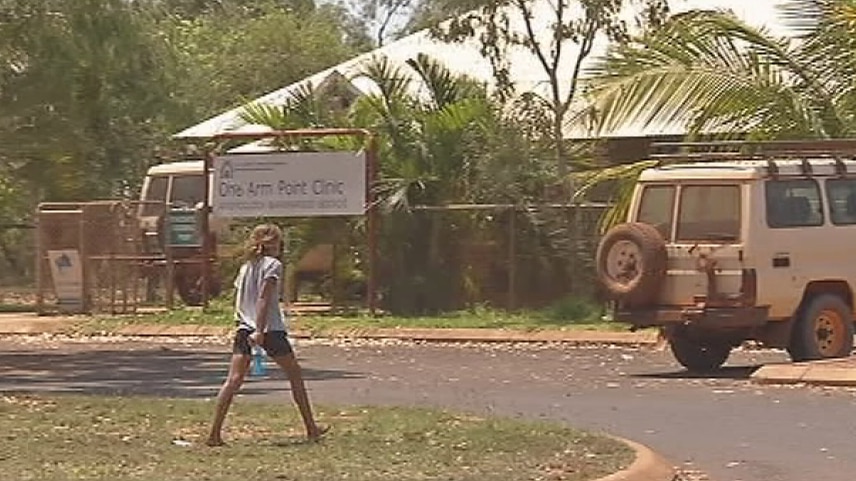 A young girl walks in front of One Arm Point clinic in Kimberley