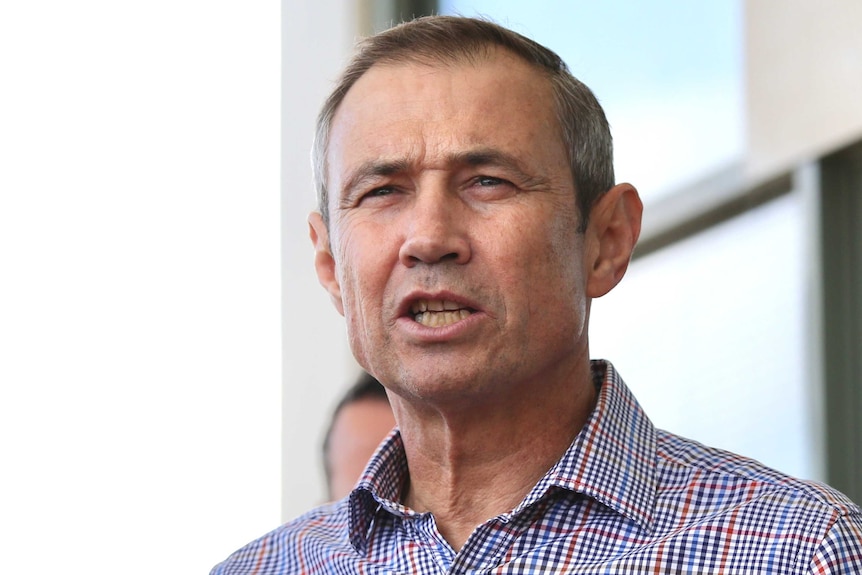 WA Health Minister Roger Cook is mid-speaking at a media conference outside Mark McGowan's office.