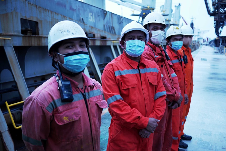 Foreign seafarers onboard a vessel docked at Sydney's Port Botany.