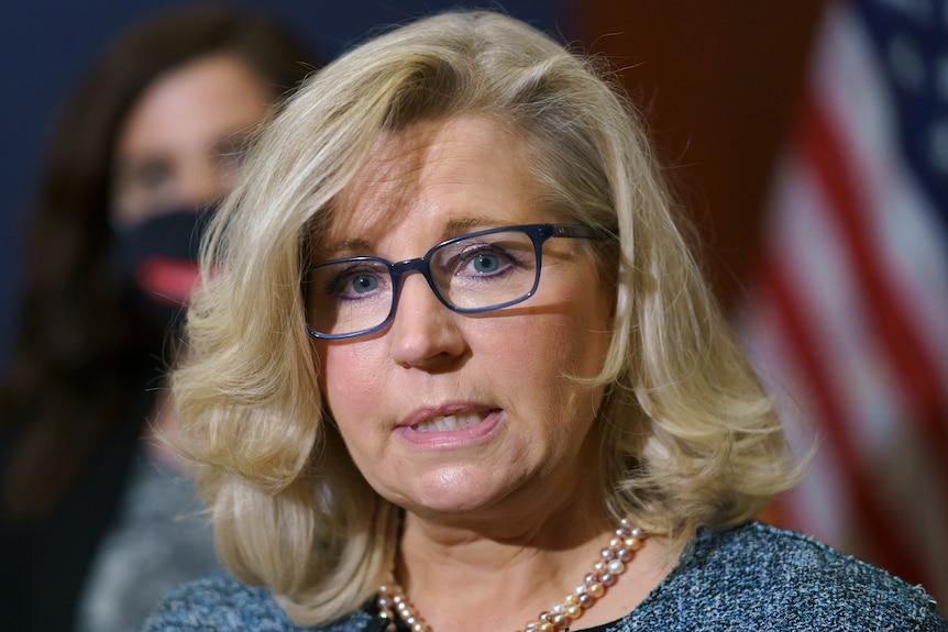 A close-up portrait image US Representative Liz Cheney speaking with reporters in Washington. 