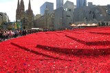 Hand-made poppies placed around Federation Square
