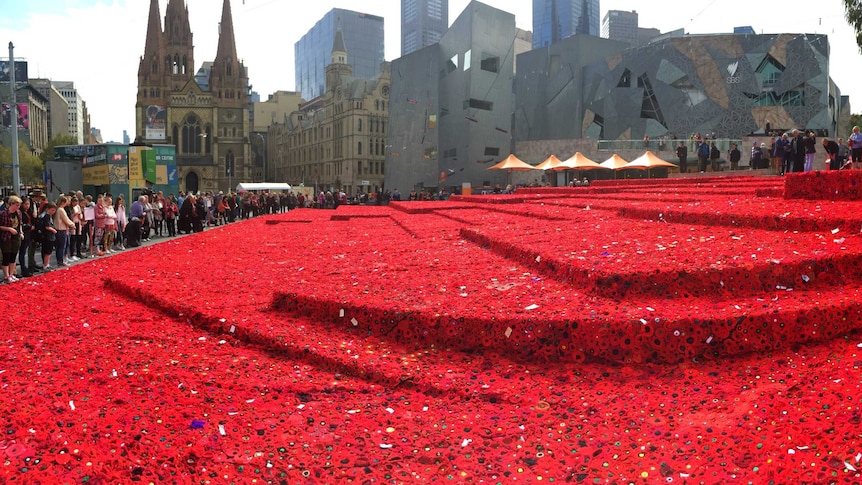 Hand-made poppies placed around Federation Square