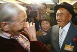 South Korean Lee Sun-gyu (L), 85, smiles with her North Korean husband Oh In-se (R)