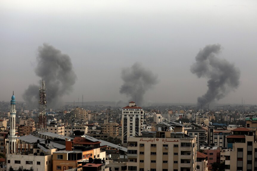 Smoke rises from Gaza City's skyline. 