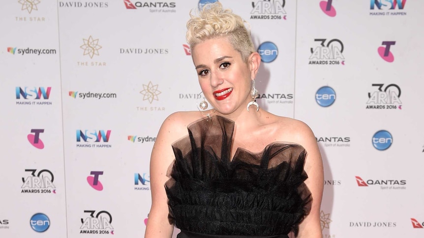 Katie Noonan wears a black dress on the red carpet at the ARIA Awards.