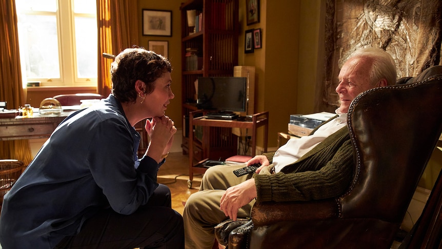 A still from The Father showing a woman in conversation with an older man in a study