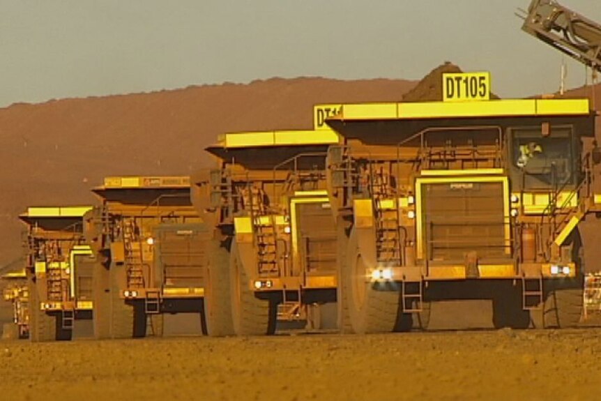 Mining trucks on Cloudbreak mine site in the Pilbara region