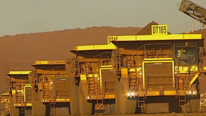 Mining trucks on Cloudbreak mine site in the Pilbara region