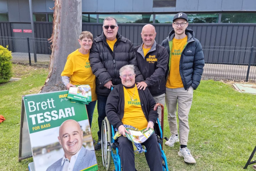 A group of people wearing bright coloured campaign shirts, including Nationals candidate Brett Tessari.