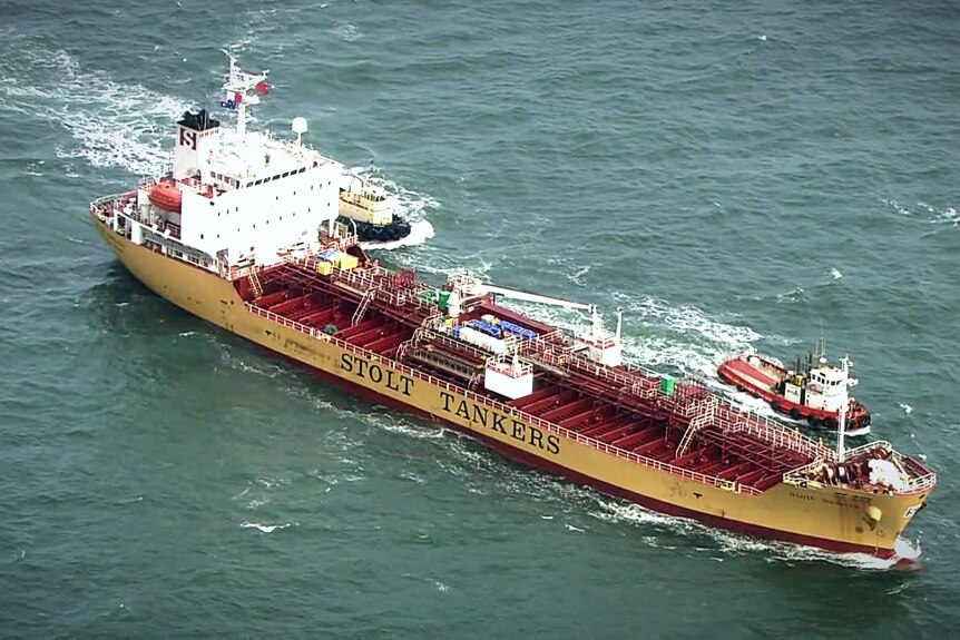 An aerial shot of a large ship in an ocean