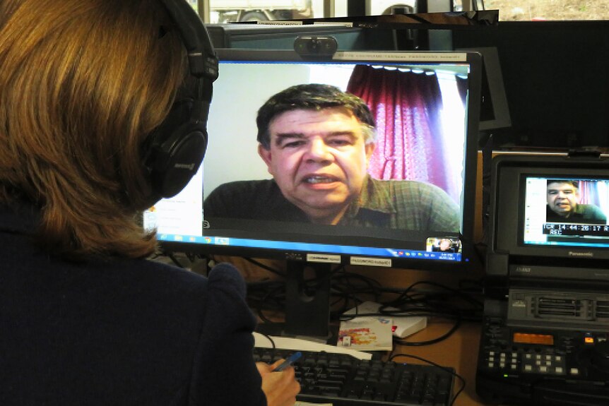 A man is pictured on a computer screen during internet interview.