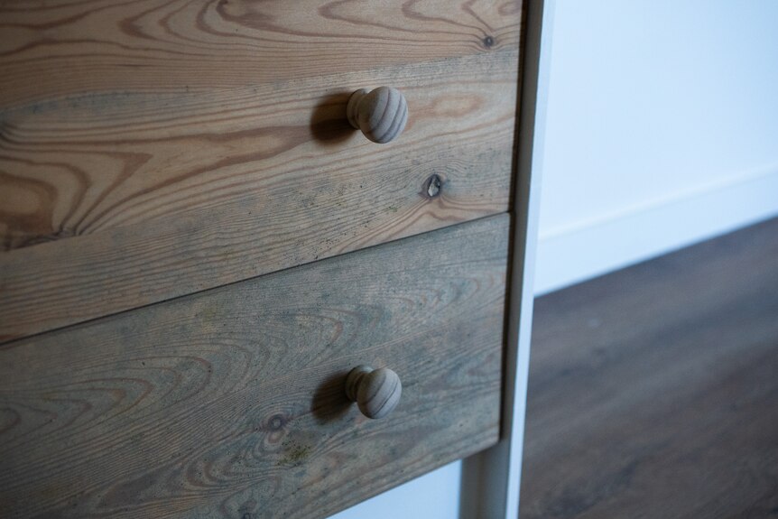 Mould on a set of drawers.