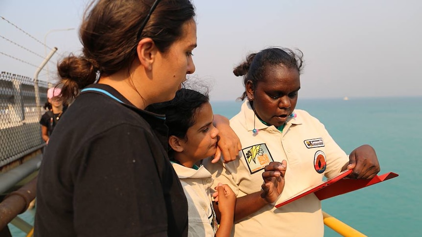 Broome Senior High School students using the Eye on Water app at the Broome jetty to help the CSIRO monitor water changes