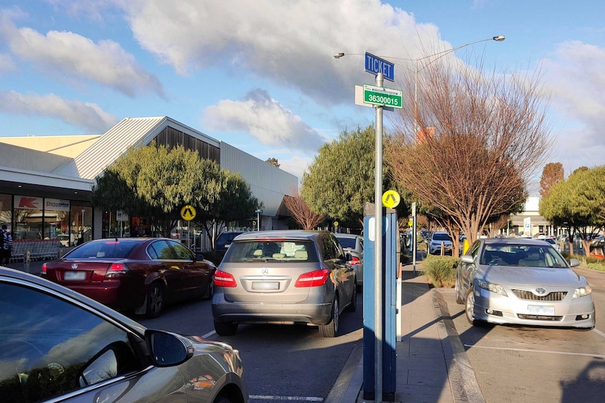A street view shows cars parked outside the Vaughan street coles.