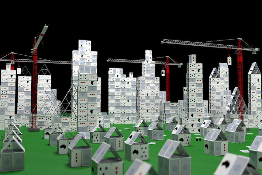 Image of a city full of both houses and towers being constructed out of cards by tall cranes.