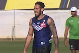 A mid shot of Fremantle Dockers midfielder Harley Bennell in a purple jersey at training.