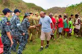 Personnel from the HMAS Tobruk farewell members of the Dillon's Bay Vanuatu community