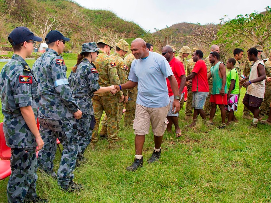 Personnel from the HMAS Tobruk farewell members of the Dillon's Bay Vanuatu community