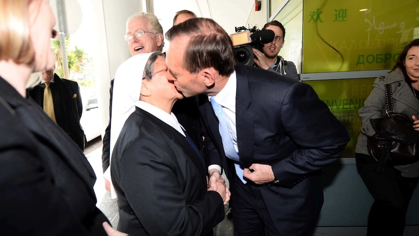Tony Abbott kisses Sister Jacinta during a visit to St Vincent's Hospital in Sydney