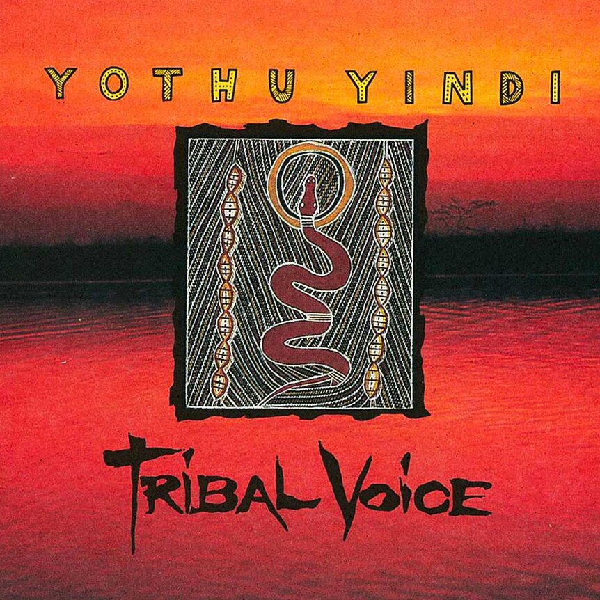 The bright orange cover of Yothu Yindi's Tribal Voice, featuring a photo of a river and a painting of a snake