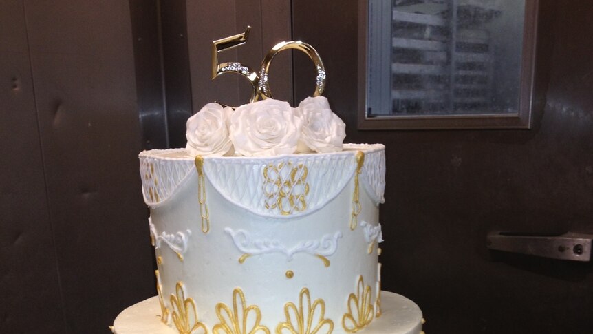 A cake adorned with gold.