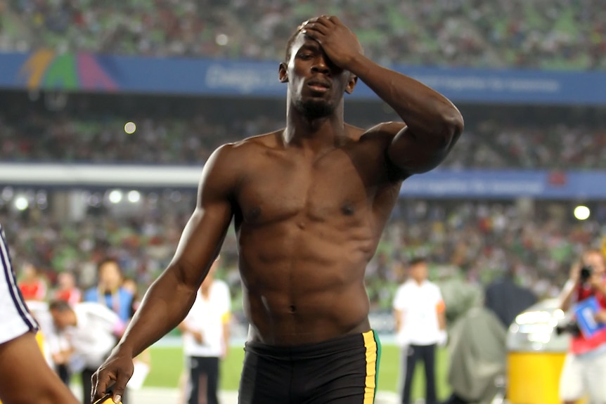 Bolt shows his dejection after being disqualified