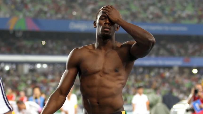 Sensational exit ... Usain Bolt shows his dejection after being disqualified in the 100 metres final (Getty Images: Michael Steele)