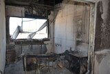 An office that has been burnt out and heavily damaged.