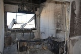 An office that has been burnt out and heavily damaged.