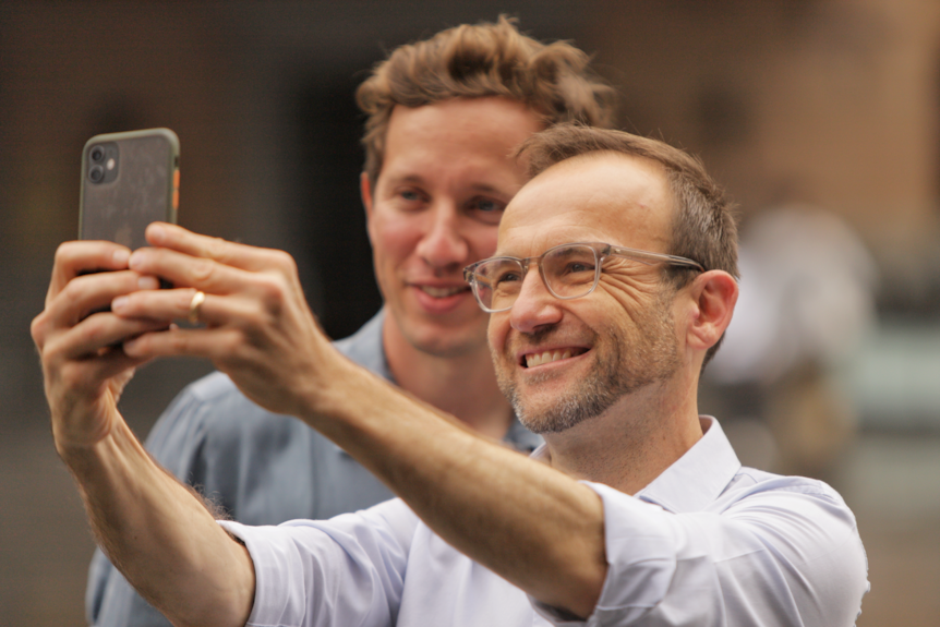 Greens leader Adam Bandt takes a selfie with Greens Griffith MP Max Chandler-Mather