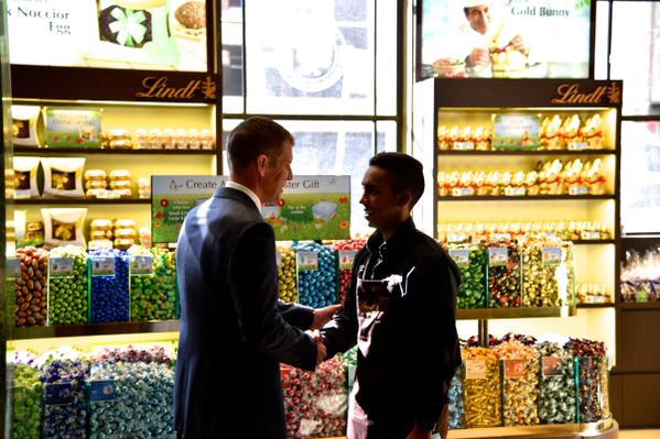 NSW Premier Mike Baird shakes hands with Lindt siege survivor Joel Herat