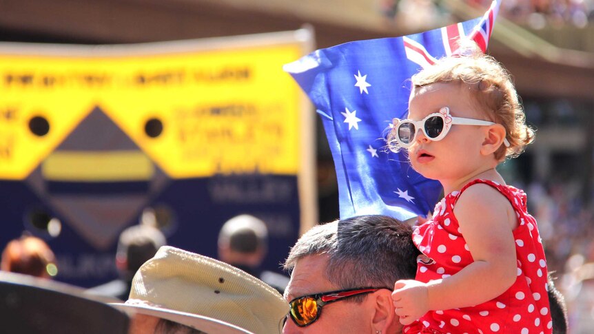 Katie Trembath watches her dad march in the Brisbane Anzac Day parade.