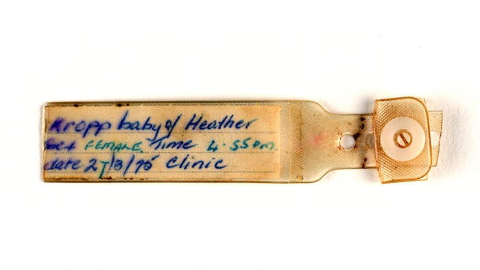 A baby identification bracelet saying Kropp, baby of Heather from 1975