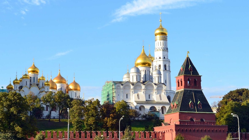 A series of large buildings with golden domes
