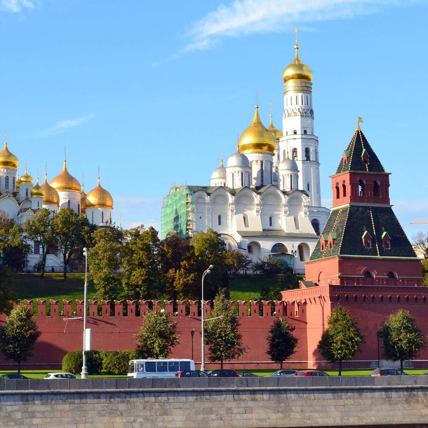 A series of large buildings with golden domes