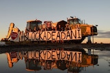 A sign saying Blockade adani