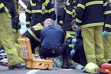 Shooting: Paramedics work on one of the victims