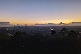 A sunrise from a mountain lookout, viewing Brisbane as dawn breaks.