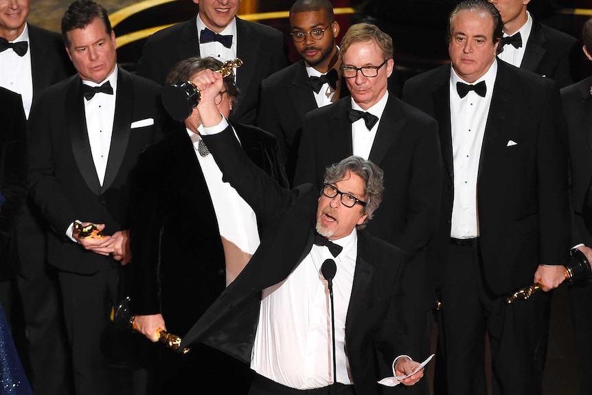 Peter Farrelly holds aloft his Oscar after Green Book won best picture at the 2019 Academy Awards.