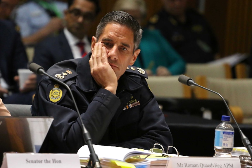 Border Force Commissioner Roman Quadvlieg leans his head on his hand.