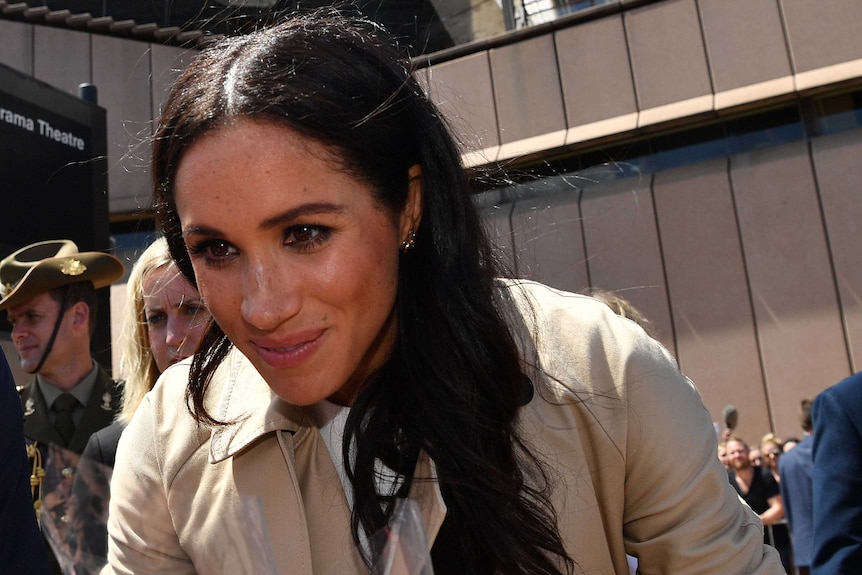 Meghan Markle being given a rose