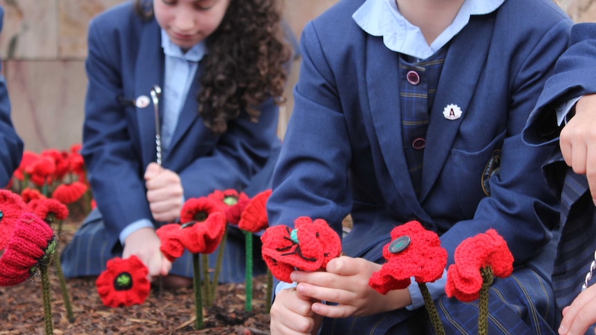 Students at Melbourne's Federation Square tend to crocheted poppies.
