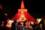 People demonstrate in front of replica Eiffel Tower at COP21