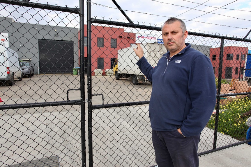 Con Mancuso stands at the front fence of his factory at Campbellfield in Melbourne's north.