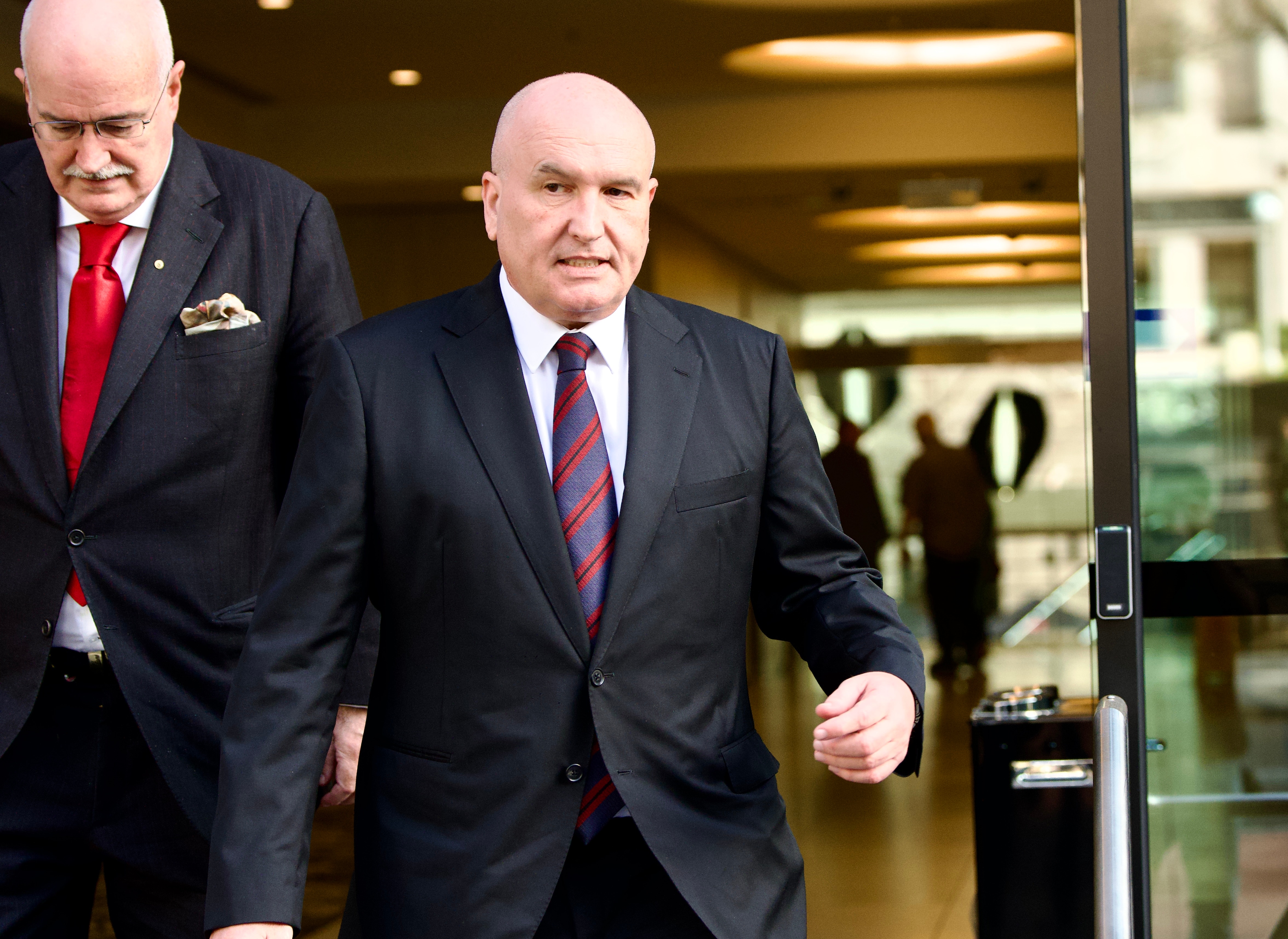 Ex-minister threatens legal action over 'slanderous' comments