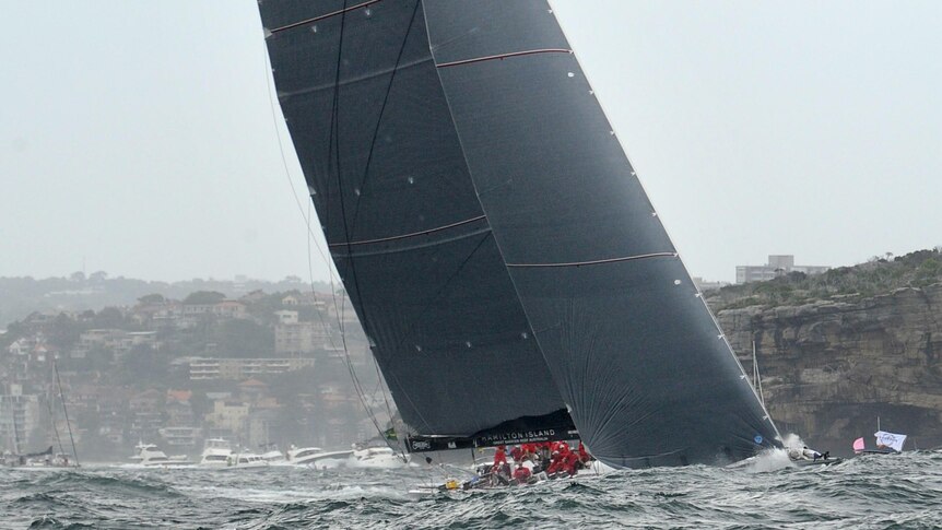 Chopper gets good view of Wild Oats XI during the start of the Sydney to Hobart yacht race.