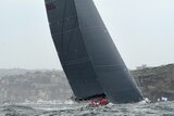 Chopper gets good view of Wild Oats XI during the start of the Sydney to Hobart yacht race.